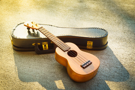 ukulele on a concrete floor