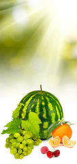 Isolated image of a watermelon, grapes, cherries, raspberries, orange juice,