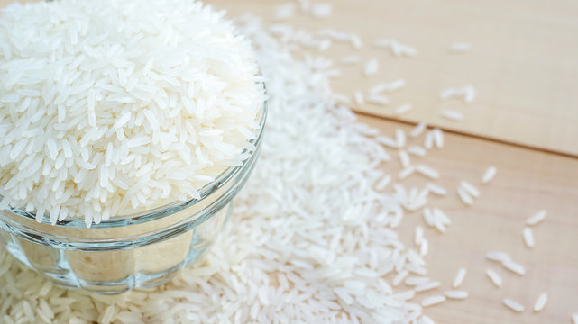jasmine rice in a bowl on a wooden background.