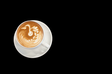Hot cafe latte wirh latte art on black background