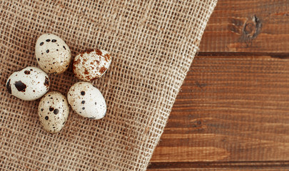Quail eggs lying on the sacking. The concept of healthy eating and vegetarianism.