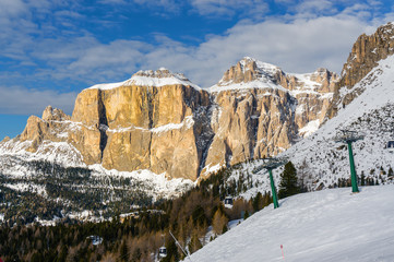 Fototapeta na wymiar Cloudy view of Belvedere valley near Canazei of Val di Fassa, Trentino-Alto-Adige region, Italy.