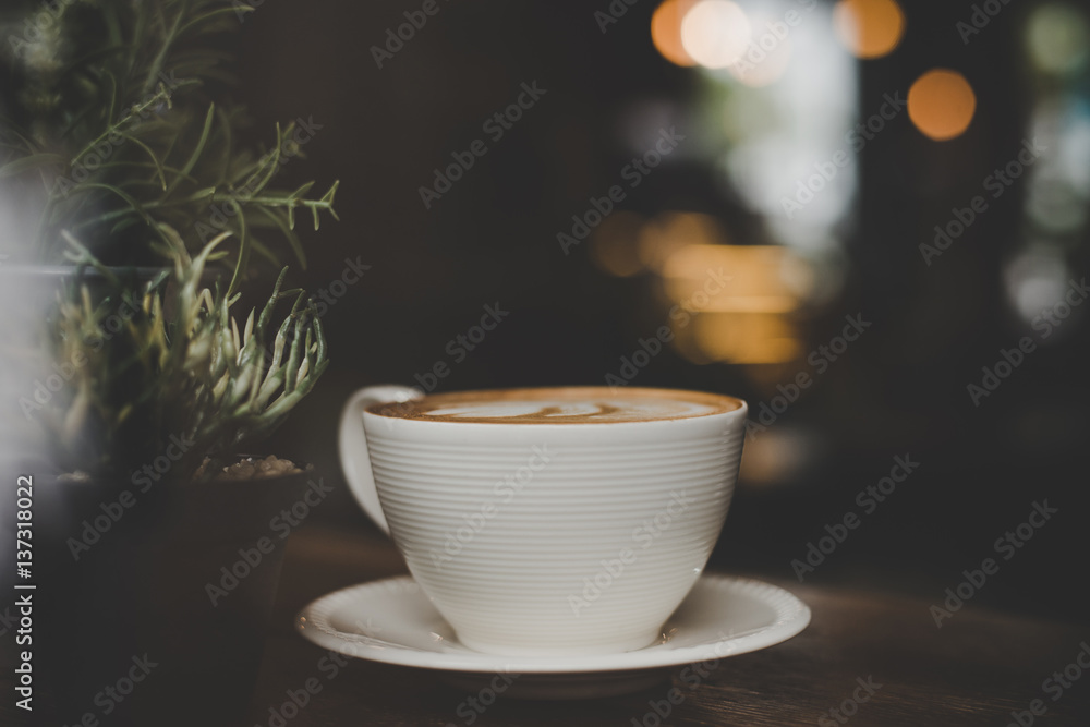 Wall mural vintage style effect picture of coffee cup in cafe.