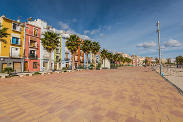 Promenade and beach in colorful village of Villajoyosa in Spain