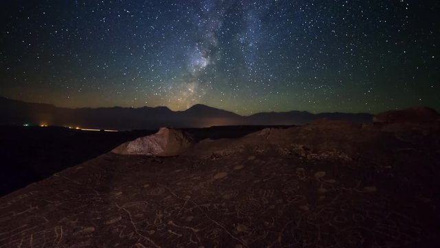 Astro Timelapse of Milky Way over Native American Petroglyphs -Tilt Up-
