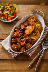Tasty Hungarian goulash with fried dumplings