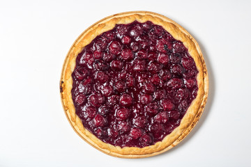 American homemade cherry pie on the table. Horizontal top view