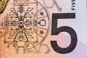 Australian 5 dollar bill fragment closeup showing the Parliament House in Canberra.