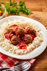 Homemade Meal of Saucy Meatballs on a Bed of Rice