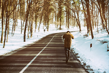 Athletic young man running in the nature. Healthy lifestyle - burning calories