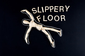 wooden dummy figurine laying on the floor with chalk outline  and 