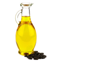 Sunflower seed oil in bottle and seeds
