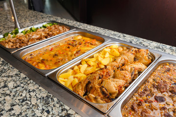 Heated cages with meat dishes