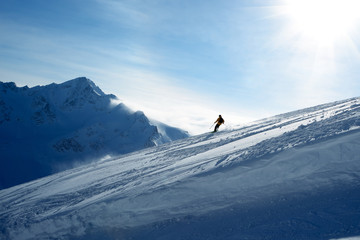 Skier going down the slope