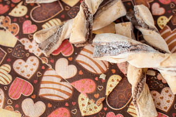 Cookies on dark napkin with image of hearts