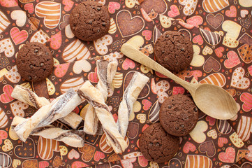 Cookies on dark napkin with image of hearts