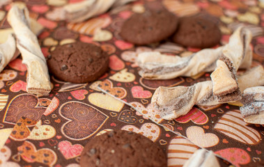 Cookies on dark napkin with image of hearts