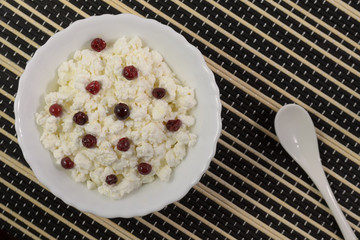 Cottage cheese with berries, cranberries, cherries.