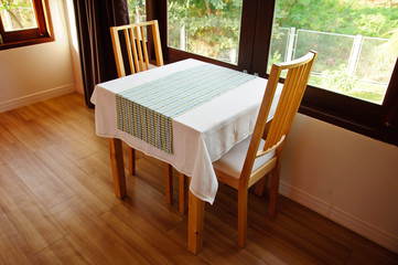 Empty dining table and window light