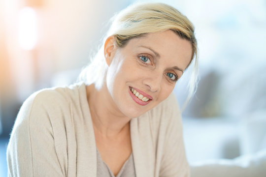 Portrait of smiling middle-aged blond woman