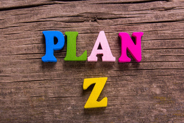 plan Z word made from colored wooden letters on an old table. Concept