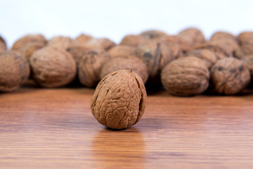 A lot of scattered walnuts close-up. A useful product.