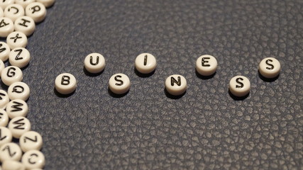 Business word on circle blocks.