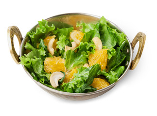 Vegetarian indian restaurant dish, fresh cashew and orange salad isolated