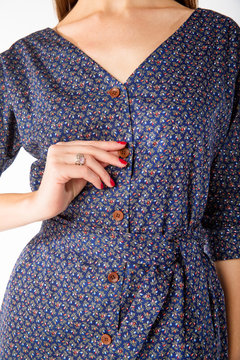 Details of women's clothing. Detail dress on a model on a white background