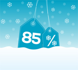 Blue hanging price tag labels with 85% and snowflake percent design texts on them on snow background. For winter sale campaigns.