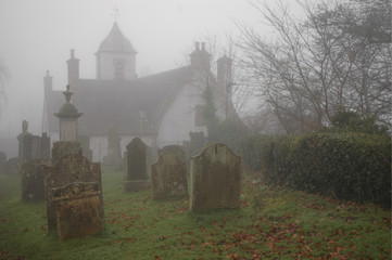 Spooky graveyard and old hospital building