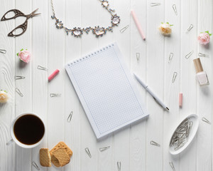 Workspace with women's accessories on a white old wood background