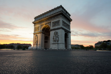 Fototapeta na wymiar Arc de Triomphe and Champs Elysees, Landmarks in center of Paris, at sunset. Paris, France