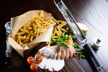 Ingredients for cooking Italian pasta with Turkey,tomatoes and greens.