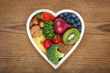 Healthy food in heart shaped bowl