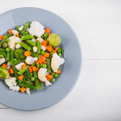 Delicious mix of vegetables on the plate. View from above. Close-up