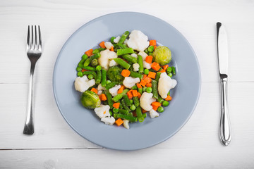 Delicious mix of vegetables on the plate. View from above. Close-up