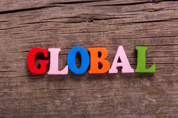 global word made from colored wooden letters on an old table. Concept