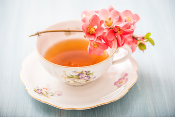 chamomile tea in a glass cup on wooden background