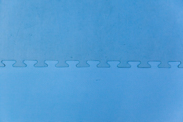 Blue protective rubber coating on children or sport playground.