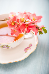 chamomile tea in a glass cup on wooden background