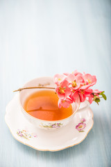 chamomile tea in a glass cup on wooden background