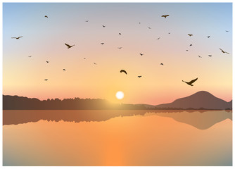 Image landscape. Sunset on exotic island with volcano. A flock of birds on the background of colorful sky .