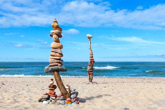 Balance and poise stones. Rock zen on the background of blue sky and sea