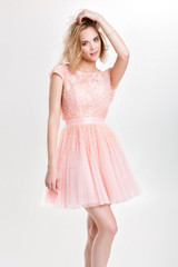 beautiful sensual and sexy blond woman in pink cocktail dress po