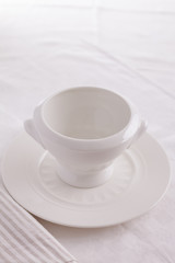 Fototapeta na wymiar exquisite porcelain plate. white empty plate on a white background