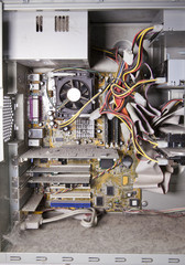Inside of the old, disassembled, covered with dust computer.