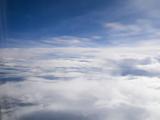 Sky and White cloud From inside the plane