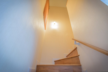 light and wooden staircase view.