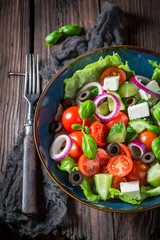 Spring Greek salad with feta cheese, black olives and lettuce